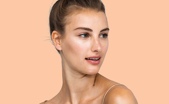 upclose of woman with radiant skin care and neutral makeup 